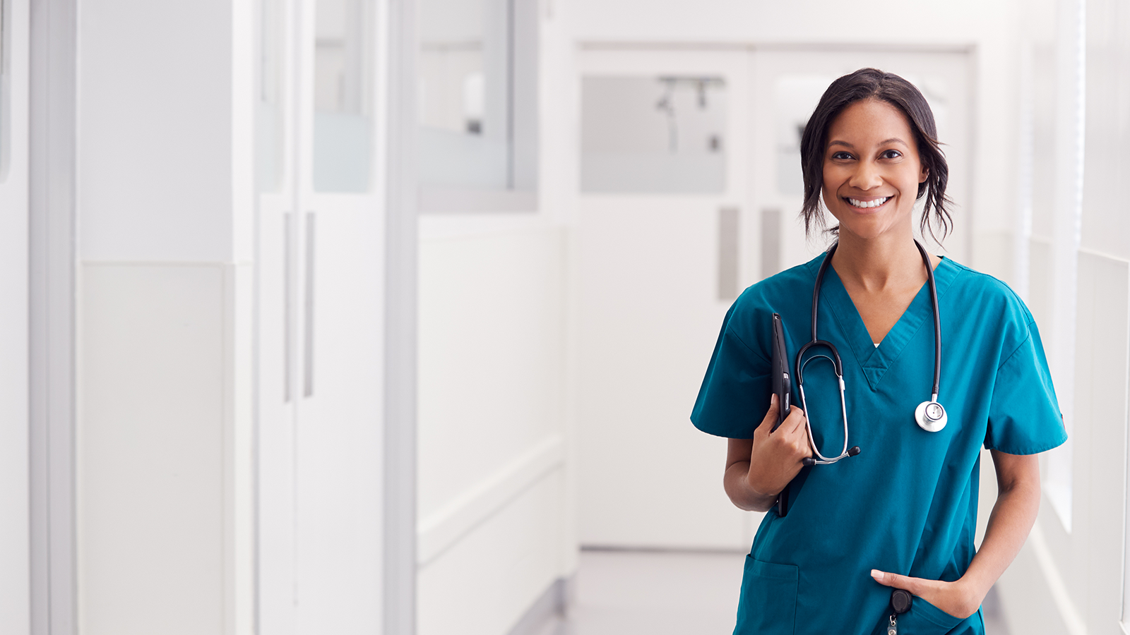 Female medical staff standing in hall of hospital